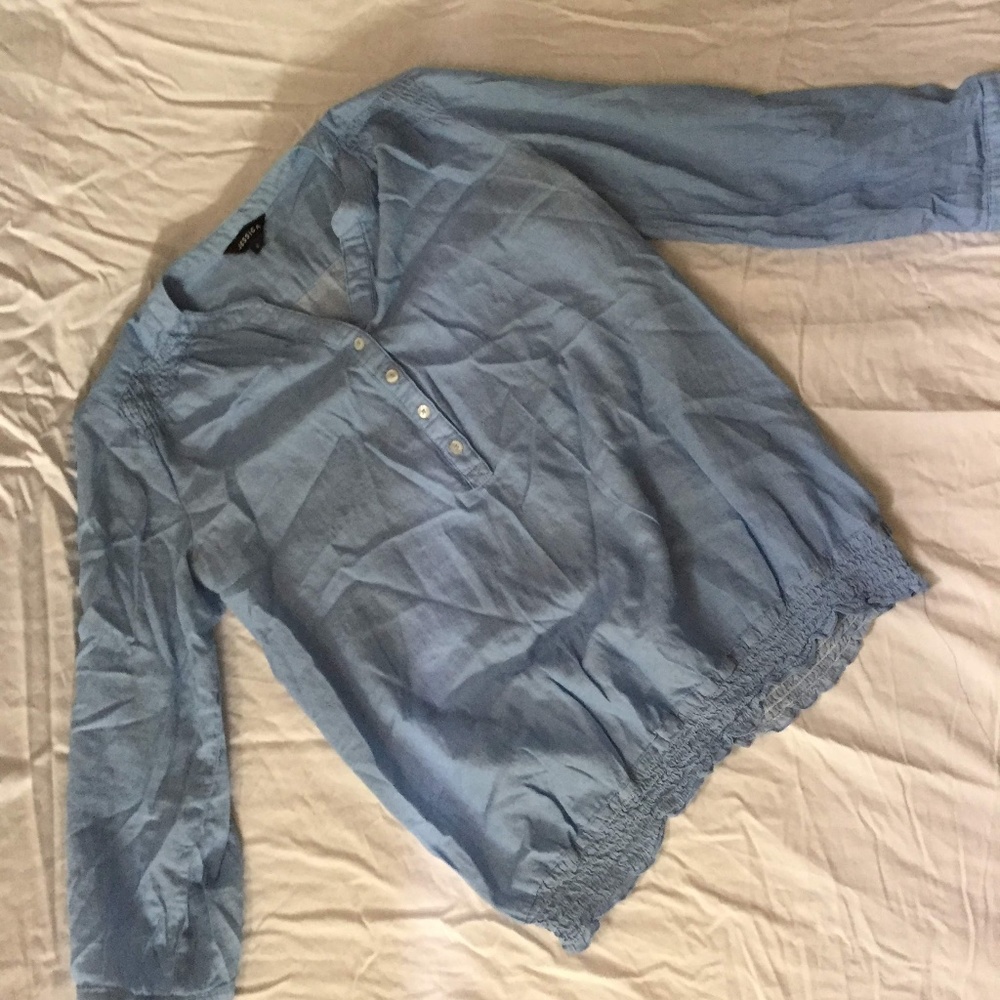 blue 3/4 sleeve blouse in a light blue.